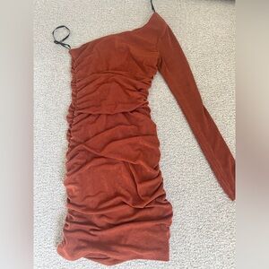Burnt orange one shoulder synched dress.